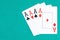 Poker aces cards on green gaming table