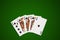 Poker cards on green, clipping path.