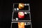 Poker cards with Japanese sushi roll pieces on dark chalkboard background. Asian rolls with shrimp, cucumber, salmon, avocado and