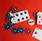 Poker cards, pocker chips, money, pocker dice on red background. gambling, board games