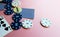 Poker chips and cards on a pink background. The game of poker. Chip dealer. Place for text