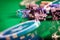 Poker chips and green felt abstract background