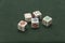 Poker Dice against Green Background straight