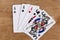 Poker full house playing card, wooden background