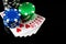 Poker game with royal flush combination. Chips and cards on the black table. Successful and maximum win. Free advertising space