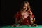 Poker girl wins a jackpot in a casino. On a black background. Winning in a casino
