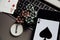 Poker play online. Poker chips, playing cards and smartphone on keyboard