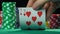 Poker player showing one pair of sevens, lucky number, winning hand. Slow motion