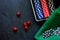 Poker set in a metallic case and green gambling cloth on a grey table top view copyspace