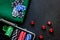 Poker set in a metallic case and green gambling cloth on a grey table top view copyspace