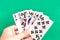 Poker straight flush playing card in womanâ€™s hand