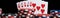 Poker winning card combination with chips, long photo on black background