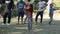 Pokhara, Nepal - 18 November 2019: A beautiful nepalese girl dancing with other kids. Smiling, nature.