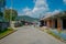 POKHARA, NEPAL - OCTOBER 06 2017: Outdoor view of different buildings with a pavement street, with some cables lines in