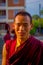 POKHARA, NEPAL - OCTOBER 06 2017: Portrit of young buddhist monk at outdoors at the Tashi refugee settlement in Pokhara