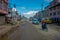 POKHARA, NEPAL OCTOBER 10, 2017: Outdoor view of asphalted road with some motorbikes, cars parked around in the street