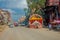 POKHARA, NEPAL OCTOBER 10, 2017: Outdoor view of asphalted road with some motorbikes, cars parked around in the street