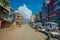 POKHARA, NEPAL OCTOBER 10, 2017: Outdoor view of asphalted road with some motorbikes, cars parked around in the street