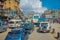 POKHARA, NEPAL OCTOBER 10, 2017: Outdoor view of asphalted road with traffict, some motorbikes, cars parked around in