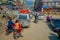 POKHARA, NEPAL OCTOBER 10, 2017: Outdoor view of asphalted road with traffict, some motorbikes, cars parked around in