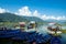 Pokhara, Nepal - October 2019: multi-colored wooden boats and catamarans near the pier on Phewa Feva Lake