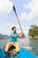 POKHARA, NEPAL - OCTOBER 29, 2011: Boatman row a boat on Phewa Lake in Pokhara. Phewa Tal or Fewa Lake is a freshwater lake in Nep