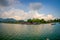 POKHARA, NEPAL - SEPTEMBER 04, 2017: Beautiful landscape of some buildings in the lakeshore with some boats in the Phewa