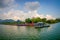 POKHARA, NEPAL - SEPTEMBER 04, 2017: Beautiful landscape of some buildings in the lakeshore with some boats in the Phewa