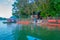 POKHARA, NEPAL - SEPTEMBER 04, 2017: Unidentified people boarding a boat to take a trip around the Phewa tal-lake in