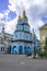 Pokrovsky Cathedral in Kharkov with light blue facades and golden roofs, vertical. The oldest