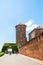 POLAND, KRAKOW - June 09, 2016: Tourists walking near Bernardine Gate and medieval Sandomierska Tower as part of famous historical