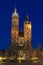 Poland, Krakow, Mariacki Church Facade Lit up at Dusk