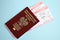 Poland passport with airline tickets on blue background close up