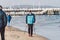 Poland, Sopot, February 9, 2020. People at beach in Sopot. Crowd on Beach During Winter. enjoying day in sunny winter near sea.