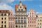 Poland, Wroclaw a row of colorful, historical facades in Wroclaw Market Square against a clear blue sky landmarks destinations,