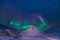The polar arctic Northern lights aurora borealis sky star in Norway Svalbard in Longyearbyen city mountain
