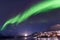 Polar arctic Northern lights aurora borealis sky star in Norway Svalbard in Longyearbyen city travel mountains