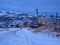 Polar night in the Northern fishing village. The dark blue hour. Old authentic village of Teriberka