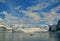 Polar twilight: Glaciated mountains with cloudy blue sky