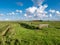 Polder landscape with grazing sheep, dike, grassland and farmhouse on Frisian island Texel, Noord-Holland, Netherlands