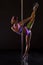 Pole dance. dancer with fluorescent bodyart