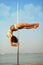 pole dance girl against sea.