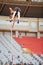 Pole vaulter goes over bar at Grand Sports Arena