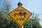 Polebridge, Montana - July 2, 2021: Funny sign for a Sasquatch bigfoot crossing on a sunny day