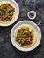 Polenta with pork sausage tomato sauce stew on dark background, top view