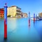 Poles and soft water on Venice lagoon in Grand Canal. Long exposure.