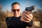 Police agent and bodyguard pointing pistol to protect from attacker