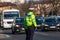 Police agents officers, Romanian Traffic Police (Politia Rutiera) directing traffic in junction during the morning traffic in