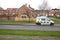 Police Camera Enforcement Unit Van parked at side of the road to enforce speed restrictions.  Speed camera sign visable