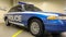 Police car Ford LTD Crown Victoria. Police car in blue with the word police in English. The passenger sedan was produced in 1991-